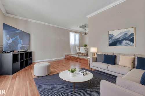 Unfurnished room featuring light wood finished floors, a ceiling fan, and a textured ceiling - 5504 18 Avenue, Edmonton, AB - Indoor Photo Showing Other Room