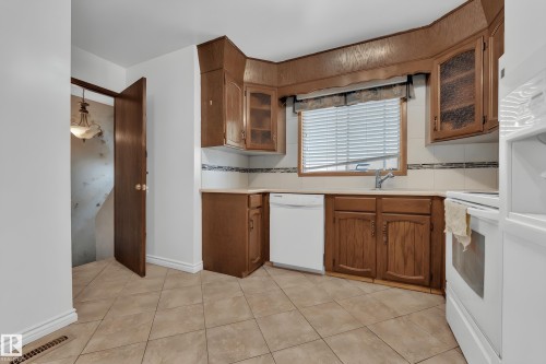 Bedroom with wood finished floors and a textured ceiling - 5504 18 Avenue, Edmonton, AB - Indoor Photo Showing Bedroom