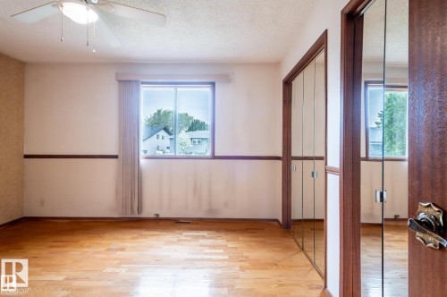 Corridor featuring light tile patterned floors and ornamental molding - 5504 18 Avenue, Edmonton, AB - Indoor Photo Showing Other Room