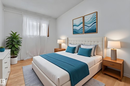 Bedroom with light wood-style floors - 5504 18 Avenue, Edmonton, AB - Indoor Photo Showing Bedroom