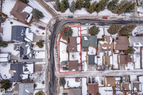 Snowy aerial view with property boundaries highlighted and a residential view - 5504 18 Avenue, Edmonton, AB -  With View