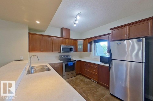 10 903 Rutherford Road Sw, Edmonton, AB - Indoor Photo Showing Kitchen With Double Sink