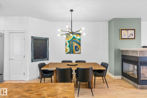 4929 Terwillegar Common, Edmonton, AB - Indoor Photo Showing Dining Room With Fireplace