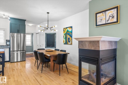 4929 Terwillegar Common, Edmonton, AB - Indoor Photo Showing Dining Room With Fireplace