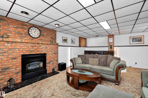 5 Groat Drive, Spruce Grove, AB - Indoor Photo Showing Living Room With Fireplace