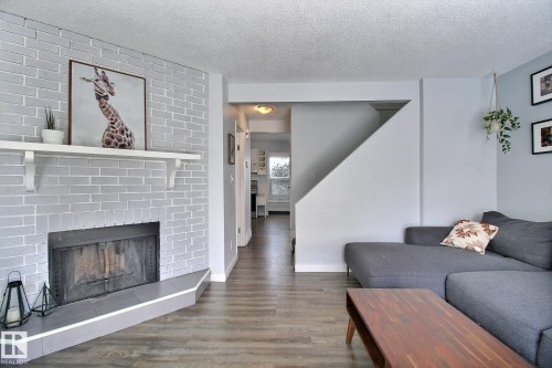 10410 28A Avenue, Edmonton, AB - Indoor Photo Showing Living Room With Fireplace