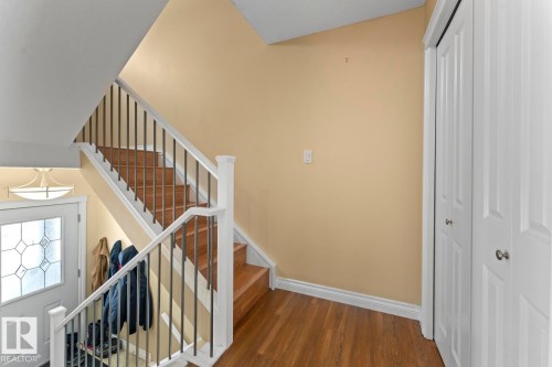 Stairway with wood finished floors and baseboards - 7 1001 7 Avenue, Cold Lake, AB - Indoor Photo Showing Other Room