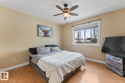 Bedroom with light wood-style floors and a ceiling fan - 7 1001 7 Avenue, Cold Lake, AB - Indoor Photo Showing Bedroom