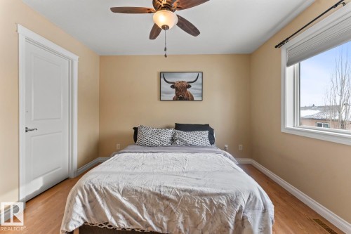 Bedroom featuring a ceiling fan and light wood finished floors - 7 1001 7 Avenue, Cold Lake, AB - Indoor Photo Showing Bedroom