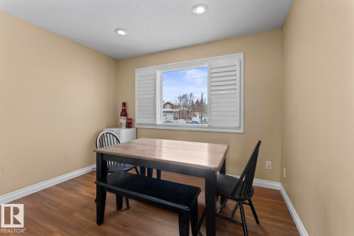 Dining space featuring dark wood-style floors and recessed lighting - 7 1001 7 Avenue, Cold Lake, AB - Indoor Photo Showing Dining Room