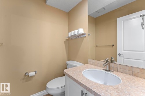 Bathroom featuring vanity and toilet - 7 1001 7 Avenue, Cold Lake, AB - Indoor Photo Showing Bathroom