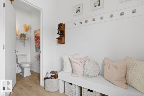 Mudroom featuring wood finished floors - 6609 47 Avenue, Beaumont, AB - Indoor