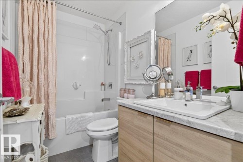 Full bath with shower / bath combination with curtain and vanity - 6609 47 Avenue, Beaumont, AB - Indoor Photo Showing Bathroom