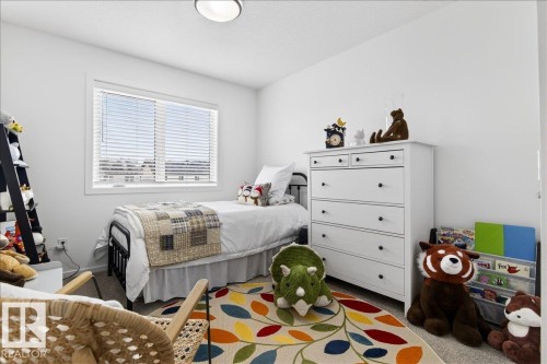 Bedroom featuring carpet floors - 6609 47 Avenue, Beaumont, AB - Indoor Photo Showing Bedroom