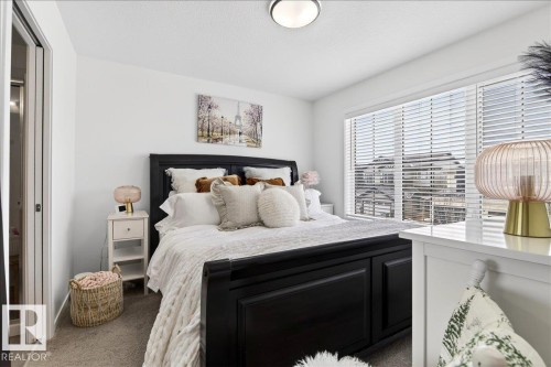Bedroom featuring carpet flooring - 6609 47 Avenue, Beaumont, AB - Indoor Photo Showing Bedroom