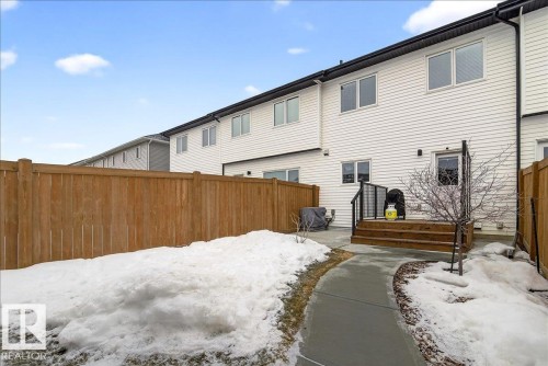 Snow covered house with a deck - 6609 47 Avenue, Beaumont, AB - Outdoor With Exterior