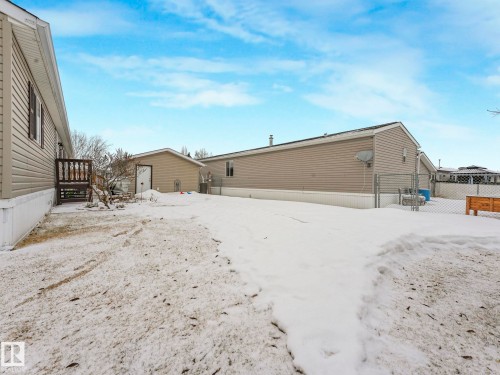 Snow covered property featuring a gate - 151 3400 48 Street, Stony Plain, AB - Outdoor