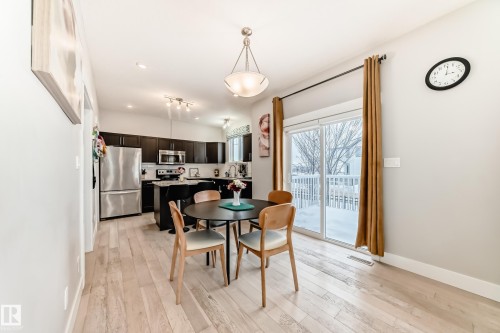 Dining area featuring light wood-style flooring and baseboards - 41 4835 Wright Drive, Edmonton, AB - Indoor Photo Showing Dining Room