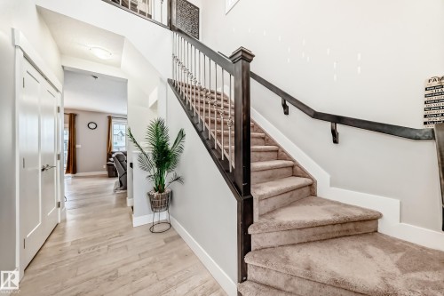 Stairs with wood finished floors and baseboards - 41 4835 Wright Drive, Edmonton, AB - Indoor Photo Showing Other Room