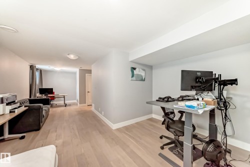 Office area with light wood-type flooring and baseboards - 41 4835 Wright Drive, Edmonton, AB - Indoor Photo Showing Office