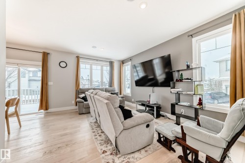 Living area featuring light wood finished floors and recessed lighting - 41 4835 Wright Drive, Edmonton, AB - Indoor Photo Showing Living Room