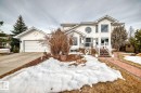 View of front of property featuring driveway, an attached garage, and a storage shed - 777 Butterworth Drive, Edmonton, AB  - Outdoor With Facade 