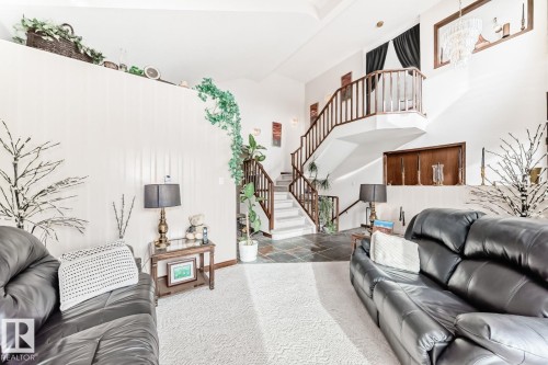 Living area with stairway and a high ceiling - 777 Butterworth Drive, Edmonton, AB - Indoor Photo Showing Other Room