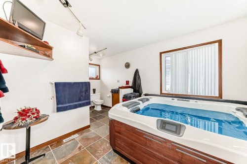 Miscellaneous room featuring a hot tub and rail lighting - 777 Butterworth Drive, Edmonton, AB - Indoor Photo Showing Other Room