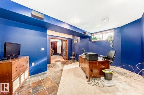 Carpeted office space with stone finish floors and recessed lighting - 777 Butterworth Drive, Edmonton, AB - Indoor Photo Showing Other Room