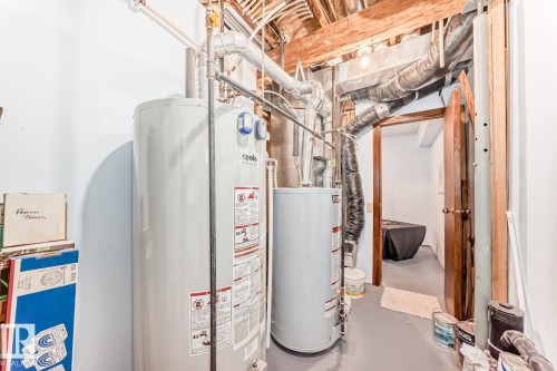 Utility room featuring water heater - 777 Butterworth Drive, Edmonton, AB - Indoor Photo Showing Basement