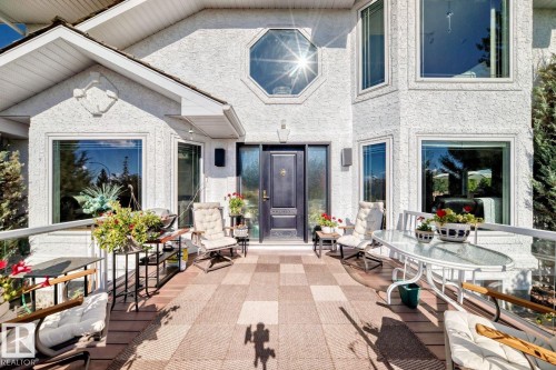 Entrance to property featuring outdoor dining space, stucco siding, and a patio area - 777 Butterworth Drive, Edmonton, AB - Outdoor