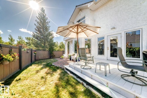 Fenced backyard with a wooden deck - 777 Butterworth Drive, Edmonton, AB - Outdoor With Deck Patio Veranda