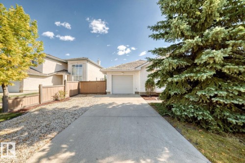 View of front of house featuring stucco siding, driveway, and a garage - 777 Butterworth Drive, Edmonton, AB - Outdoor