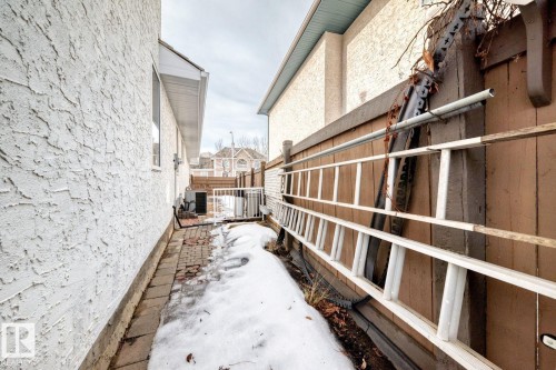 View of side of property featuring stucco siding and a central air condition unit - 777 Butterworth Drive, Edmonton, AB - Outdoor With Exterior