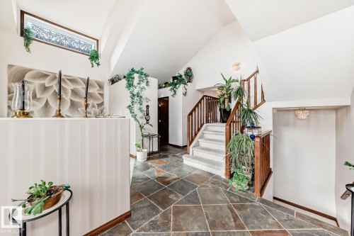 Foyer featuring stone tile floors and lofted ceiling - 777 Butterworth Drive, Edmonton, AB - Indoor Photo Showing Other Room