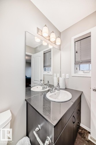 Bathroom with vanity and toilet - 2823 Duke Crescent, Edmonton, AB - Indoor Photo Showing Bathroom