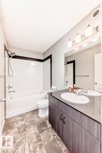 Bathroom featuring vanity and shower / tub combination - 2823 Duke Crescent, Edmonton, AB - Indoor Photo Showing Bathroom