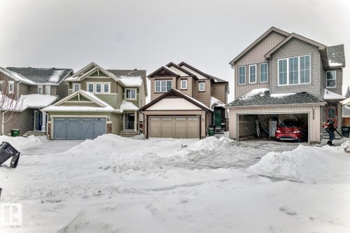 Craftsman-style home with a residential view and board and batten siding - 2823 Duke Crescent, Edmonton, AB - Outdoor With Facade