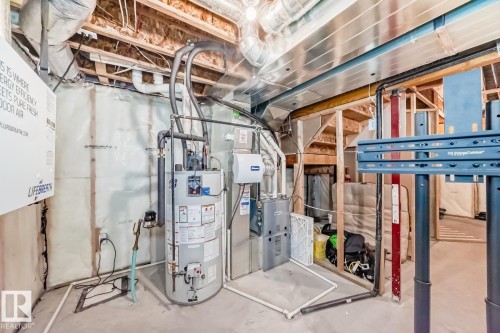 Utilities with water heater and heating unit - 2823 Duke Crescent, Edmonton, AB - Indoor Photo Showing Basement