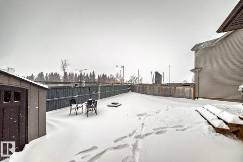 View of fenced backyard - 2823 Duke Crescent, Edmonton, AB - Outdoor With Exterior