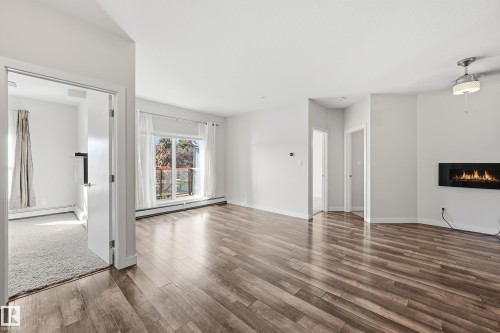 315 10611 117 Street, Edmonton, AB - Indoor Photo Showing Living Room With Fireplace