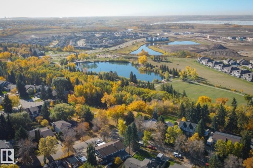 Aerial view of property and surrounding area with nearby suburban area and a nearby body of water - 38 Lancaster Crescent, St. Albert, AB - Outdoor With View