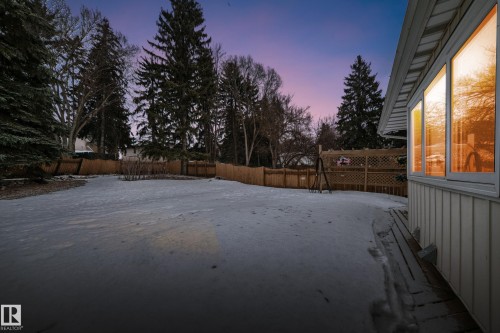 Yard at dusk with a fenced backyard - 38 Lancaster Crescent, St. Albert, AB - Outdoor