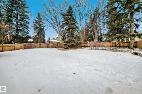 Yard layered in snow featuring a fenced backyard - 38 Lancaster Crescent, St. Albert, AB - Outdoor