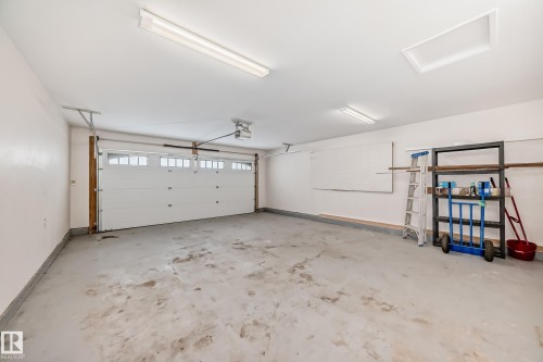 Garage featuring baseboards - 38 Lancaster Crescent, St. Albert, AB - Indoor Photo Showing Garage