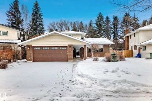 View of front of property with brick siding and a garage - 38 Lancaster Crescent, St. Albert, AB - Outdoor