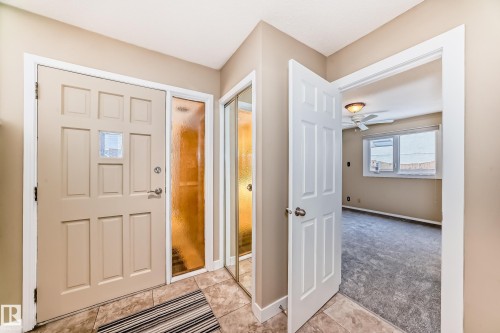 Entryway with light carpet, a ceiling fan, and light tile patterned flooring - 38 Lancaster Crescent, St. Albert, AB - Indoor Photo Showing Other Room