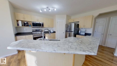7376 Singer Way, Edmonton, AB - Indoor Photo Showing Kitchen With Double Sink