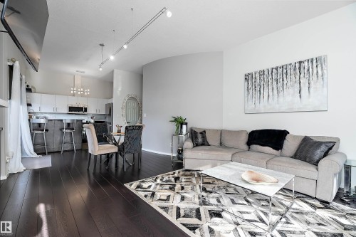 Living area with dark wood flooring - 302 10905 109 Street, Edmonton, AB - Indoor Photo Showing Living Room