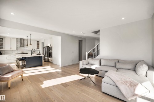 Living room featuring light wood-style flooring and recessed lighting - 11 Promenade Point(E), Beaumont, AB - Indoor Photo Showing Living Room